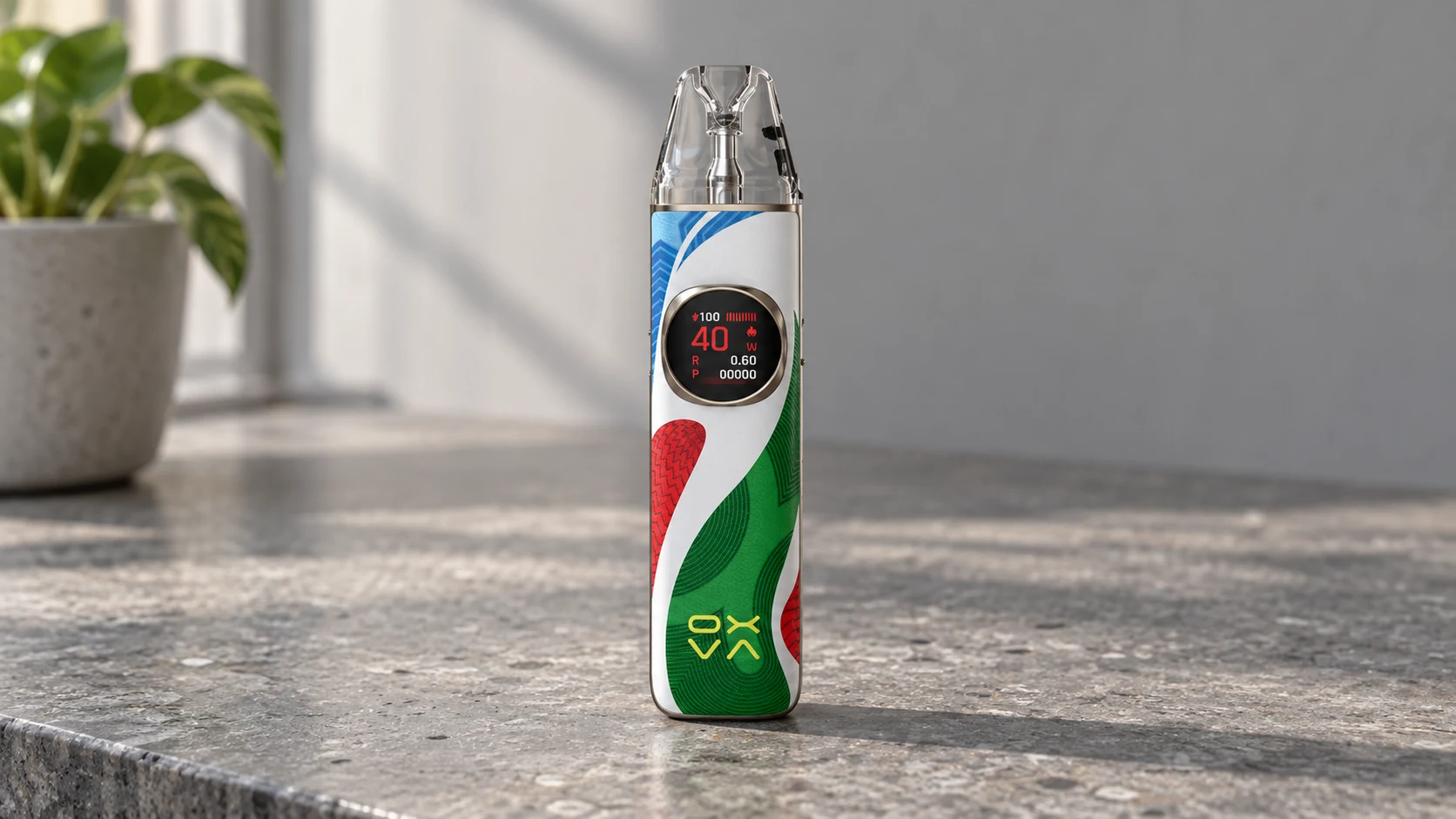 OXVA NeXLIM 2 Color Clash pod vape standing upright on a sunlit stone countertop.