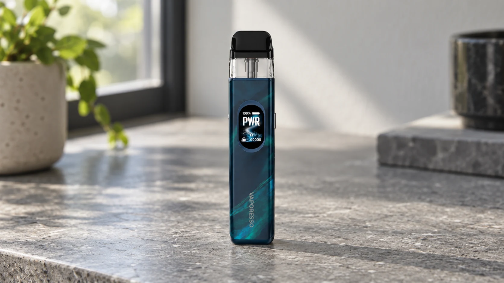 Vaporesso XROS 5 refillable pod device standing upright on a stone countertop near a window.